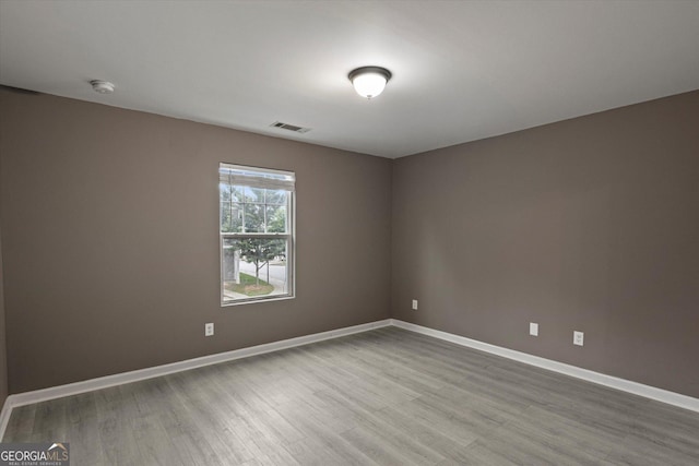 2137 Chadwick Rd SW, Atlanta, GA 30331 - unfurnished room with wood finished floors, baseboards, and a smoke detector