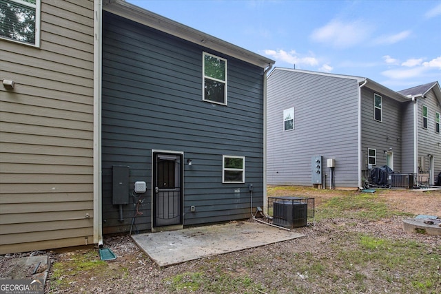 2137 Chadwick Rd SW, Atlanta, GA 30331 - back of house with central air condition unit and a patio area