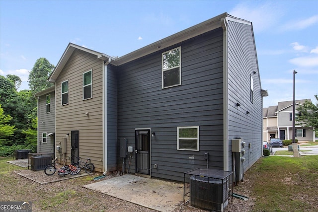 2137 Chadwick Rd SW, Atlanta, GA 30331 - rear view of house with central air condition unit and a patio area