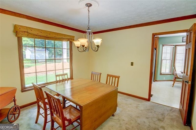 402 Princeton Way, Lawrenceville, GA 30044 - dining space featuring a chandelier, plenty of natural light, light carpet, and ornamental molding