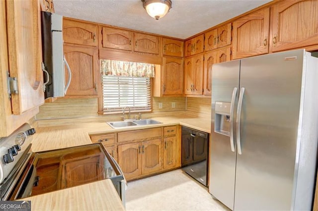 402 Princeton Way, Lawrenceville, GA 30044 - kitchen with appliances with stainless steel finishes, light countertops, brown cabinetry, and decorative backsplash