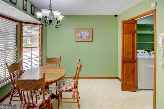 402 Princeton Way, Lawrenceville, GA 30044 - dining area with a chandelier, washer and clothes dryer, a textured ceiling, and light floors