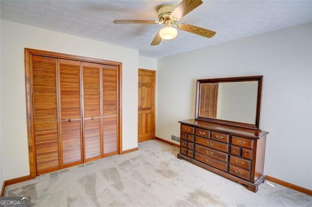 402 Princeton Way, Lawrenceville, GA 30044 - bedroom with carpet flooring, a closet, ceiling fan, and a textured ceiling