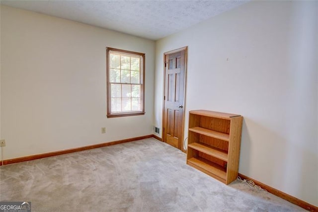 402 Princeton Way, Lawrenceville, GA 30044 - carpeted spare room featuring baseboards and a textured ceiling