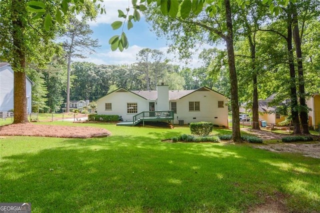 402 Princeton Way, Lawrenceville, GA 30044 - rear view of property featuring a chimney