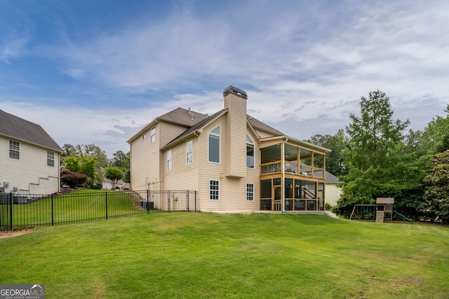 638 Glen Valley Way, Dacula, GA 30019 - rear view of house featuring a sunroom, a playground, a balcony, a chimney, and a fenced backyard