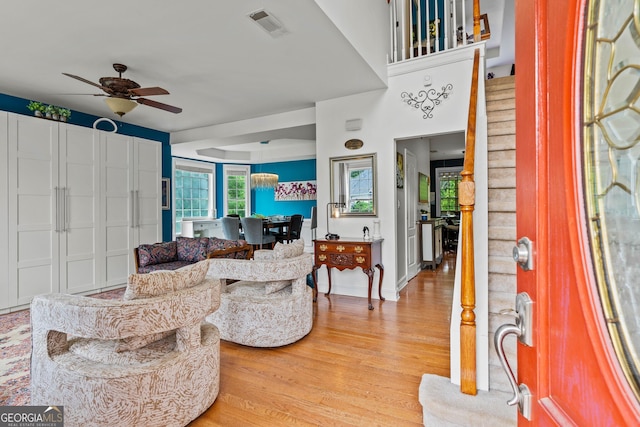 638 Glen Valley Way, Dacula, GA 30019 - living room with a ceiling fan, light wood finished floors, and stairs