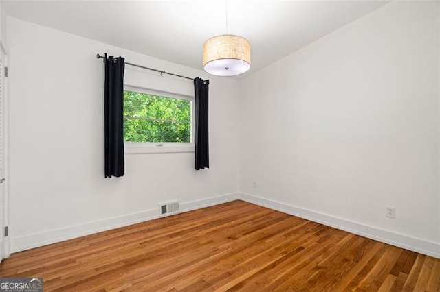 1492 Sagewood Cir, Stone Mountain, GA 30083 - spare room featuring light wood finished floors and baseboards