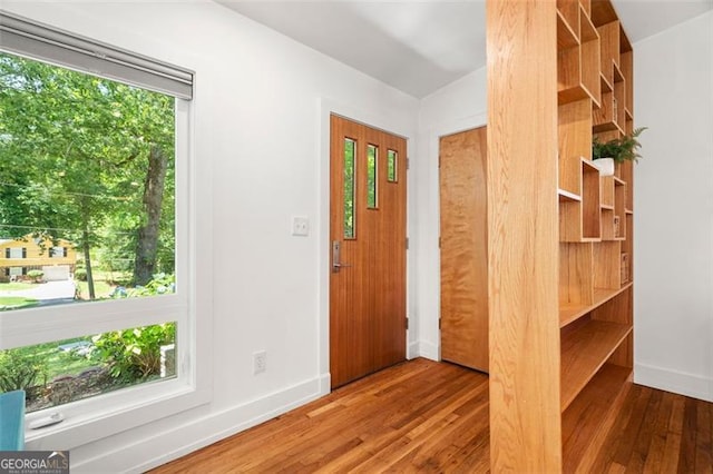 1492 Sagewood Cir, Stone Mountain, GA 30083 - entryway with wood finished floors and healthy amount of natural light