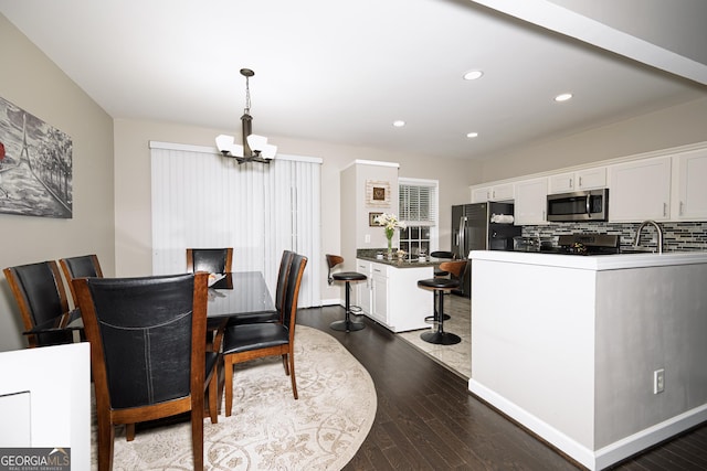3343 Lathenview Ct, Milton, GA 30004 - dining room featuring a chandelier, dark wood-type flooring, and recessed lighting