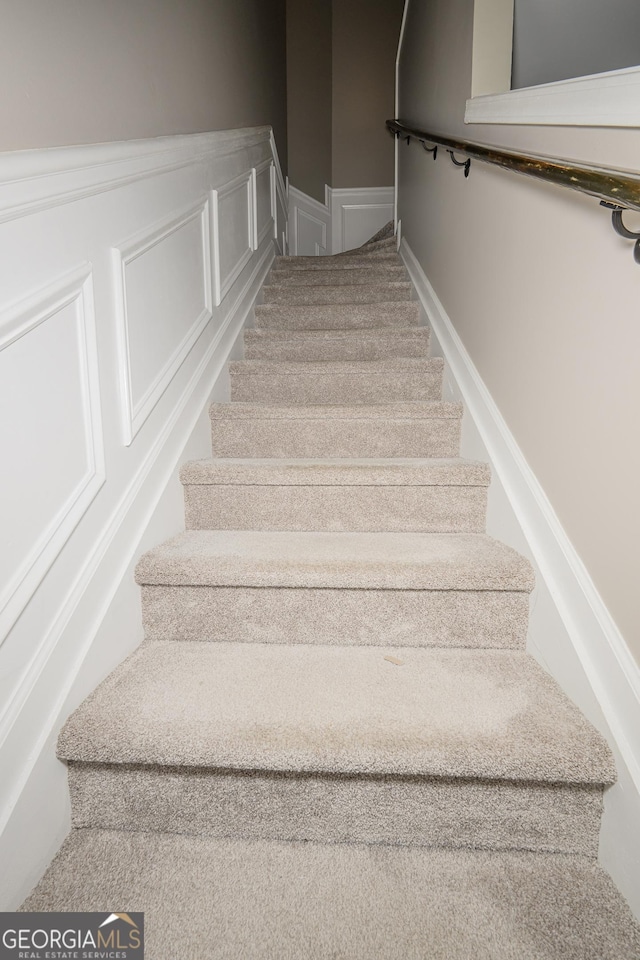 3343 Lathenview Ct, Milton, GA 30004 - stairway featuring a wainscoted wall