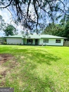 1191 Zoar Rd, Baxley, GA 31513 - rear view of property featuring a yard