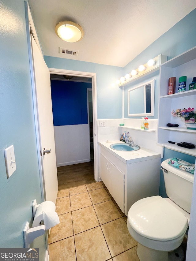 1191 Zoar Rd, Baxley, GA 31513 - bathroom featuring vanity, toilet, and tile patterned flooring