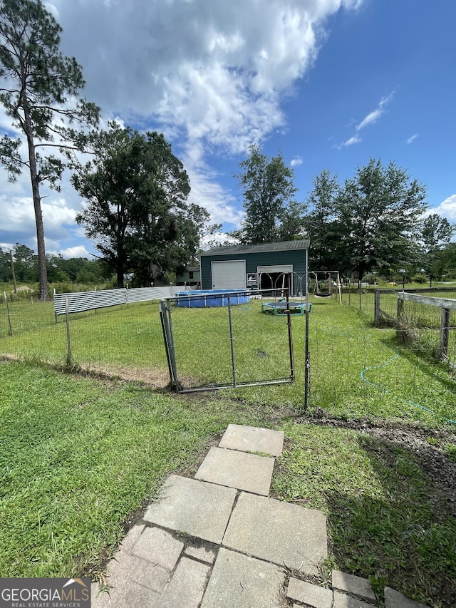 1191 Zoar Rd, Baxley, GA 31513 - view of yard featuring a detached garage