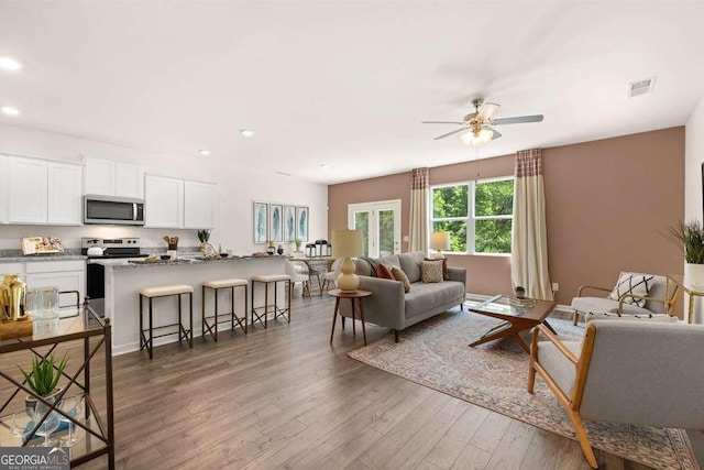 1404 Gray Branch Dr, Lawrenceville, GA 30045 - living room with recessed lighting, wood finished floors, and a ceiling fan