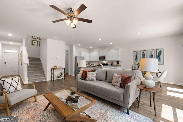 1404 Gray Branch Dr, Lawrenceville, GA 30045 - living room featuring baseboards, light wood-style flooring, a ceiling fan, stairway, and recessed lighting