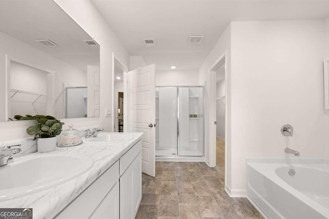 1404 Gray Branch Dr, Lawrenceville, GA 30045 - full bathroom with a walk in closet, a shower stall, double vanity, and recessed lighting