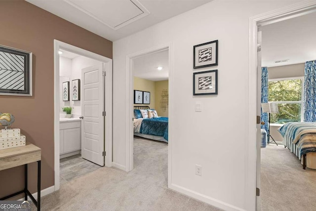 1404 Gray Branch Dr, Lawrenceville, GA 30045 - hall featuring light carpet, baseboards, and attic access