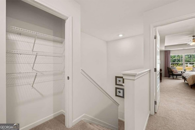 1404 Gray Branch Dr, Lawrenceville, GA 30045 - corridor featuring an upstairs landing, light carpet, and baseboards