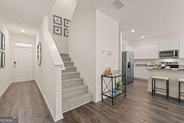 1404 Gray Branch Dr, Lawrenceville, GA 30045 - entrance foyer featuring dark wood-style flooring, recessed lighting, baseboards, and stairway