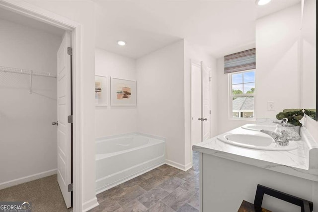 1404 Gray Branch Dr, Lawrenceville, GA 30045 - full bathroom with a bath, baseboards, a spacious closet, double vanity, and recessed lighting