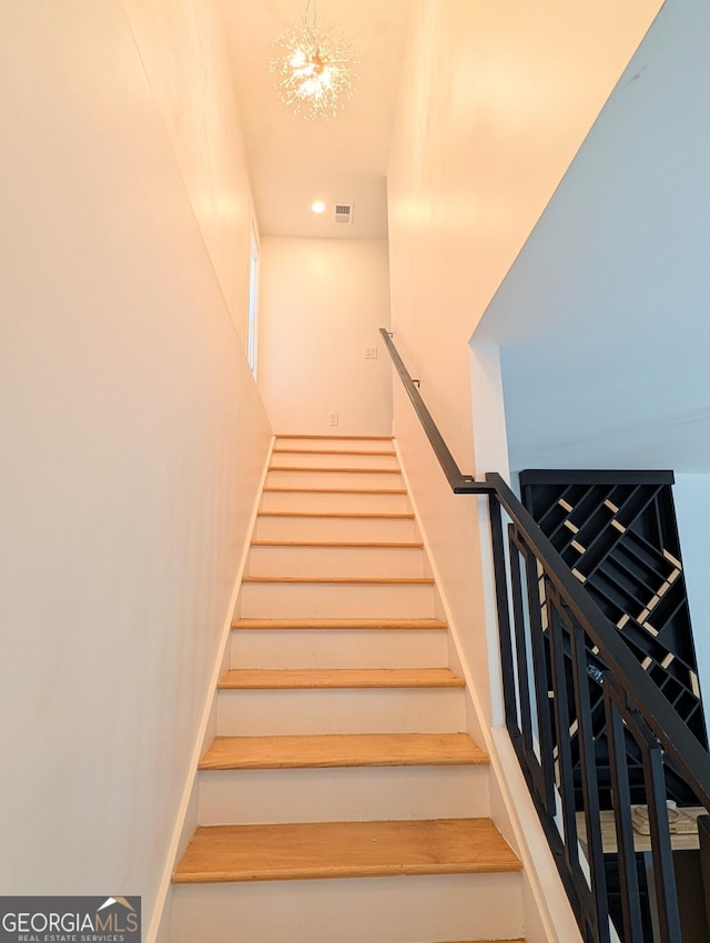 123 Dahlgren St SE, Atlanta, GA 30317 - stairs with a chandelier and recessed lighting