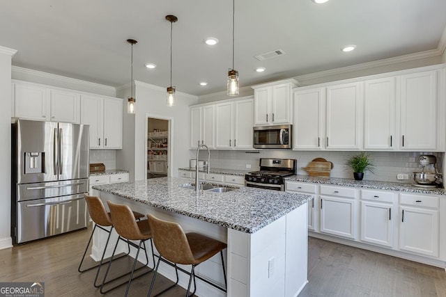 4306 Applebrook Ter, Gainesville, GA 30504 - kitchen featuring appliances with stainless steel finishes, ornamental molding, a sink, tasteful backsplash, and white cabinets