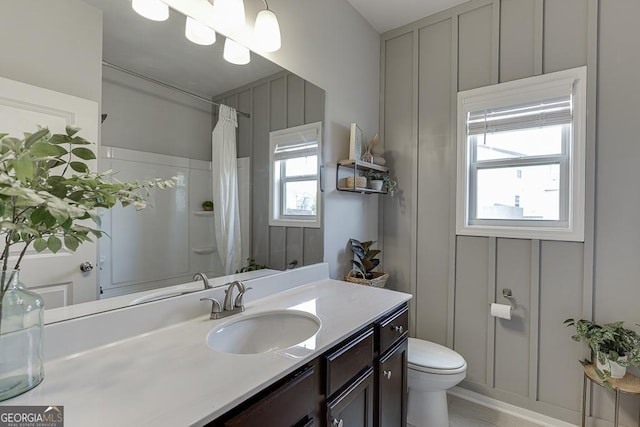 4306 Applebrook Ter, Gainesville, GA 30504 - bathroom with toilet, vanity, curtained shower, and a decorative wall