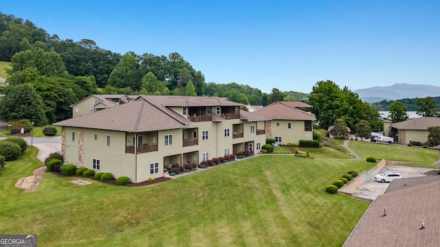 1724 Watercrest Way # G, Young Harris, GA 30582 - back of property featuring a mountain view, a yard, and a shingled roof