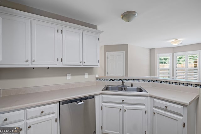 105 Paces Landing Trl, Newnan, GA 30263 - kitchen with dishwasher, a sink, a peninsula, white cabinets, and light countertops
