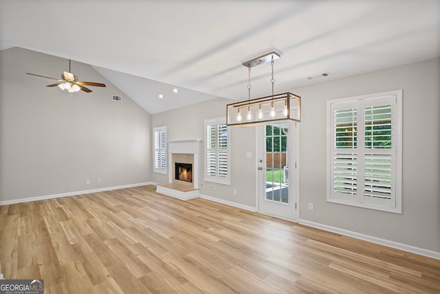 105 Paces Landing Trl, Newnan, GA 30263 - unfurnished living room with light wood-style floors, a ceiling fan, vaulted ceiling, baseboards, and recessed lighting