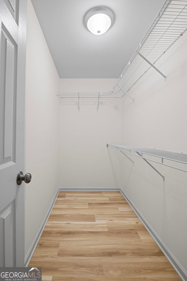105 Paces Landing Trl, Newnan, GA 30263 - walk in closet featuring light wood-type flooring