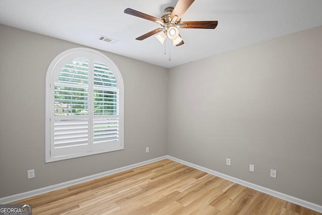 105 Paces Landing Trl, Newnan, GA 30263 - spare room with ceiling fan, light wood finished floors, and baseboards