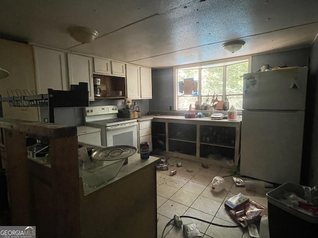 243 Lakeside Trl, Martin, GA 30557 - kitchen featuring white appliances, white cabinets, and light countertops