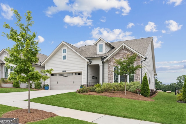 6937 River Rock Dr, Flowery Branch, GA 30542 - view of front of home featuring stone siding, driveway, a front lawn, and roof with shingles