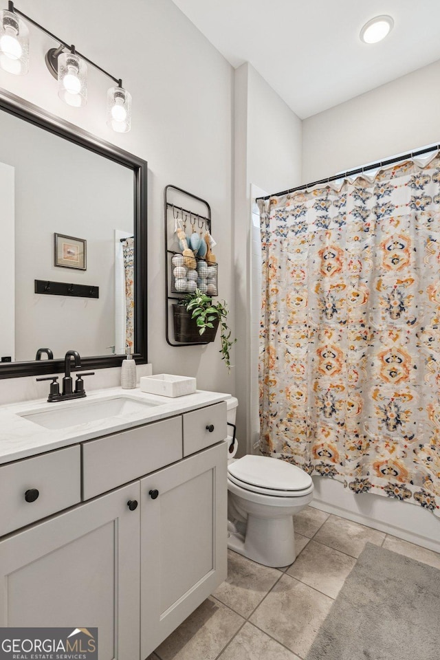 6937 River Rock Dr, Flowery Branch, GA 30542 - full bathroom with vanity, tile patterned floors, and shower / bath combo