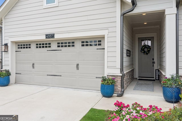 6937 River Rock Dr, Flowery Branch, GA 30542 - garage with driveway