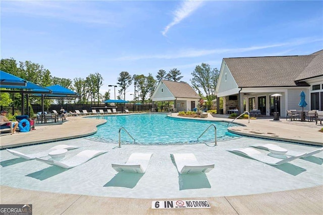 6937 River Rock Dr, Flowery Branch, GA 30542 - community pool with a patio area