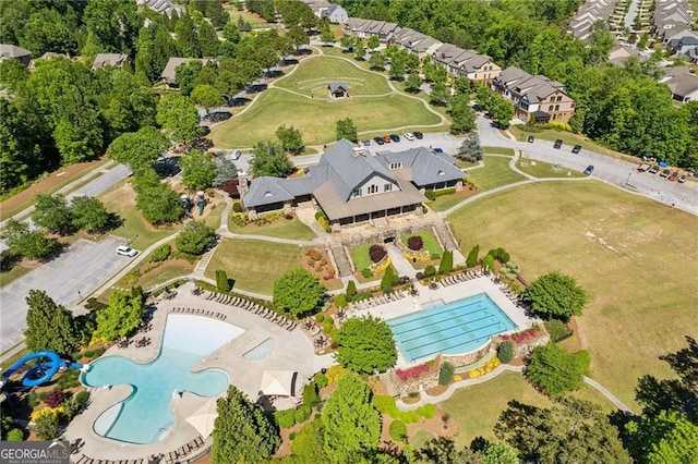 6937 River Rock Dr, Flowery Branch, GA 30542 - aerial view of property's location with a pool and nearby suburban area