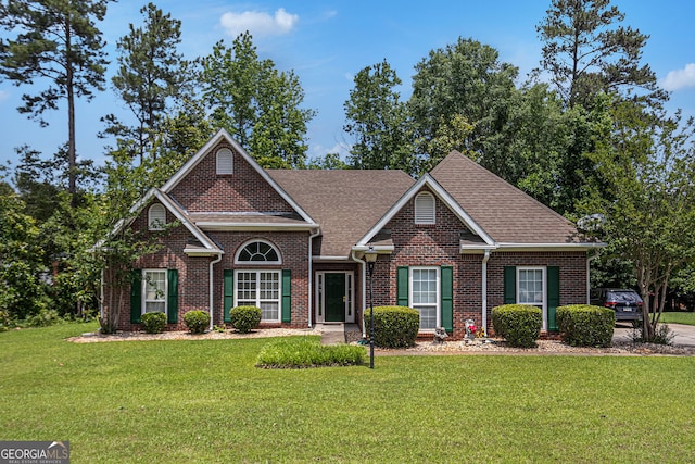 2928 Mandy Ct, Jonesboro, GA 30236 - traditional home with a front yard, brick siding, and roof with shingles