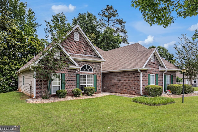 2928 Mandy Ct, Jonesboro, GA 30236 - traditional-style house with brick siding, a front lawn, and a shingled roof