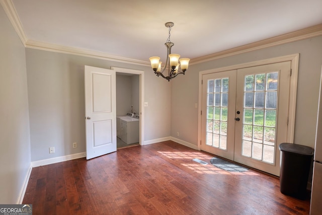 1177 Castle Way, Norcross, GA 30093 - unfurnished dining area featuring french doors, ornamental molding, washer and dryer, a chandelier, and dark wood finished floors
