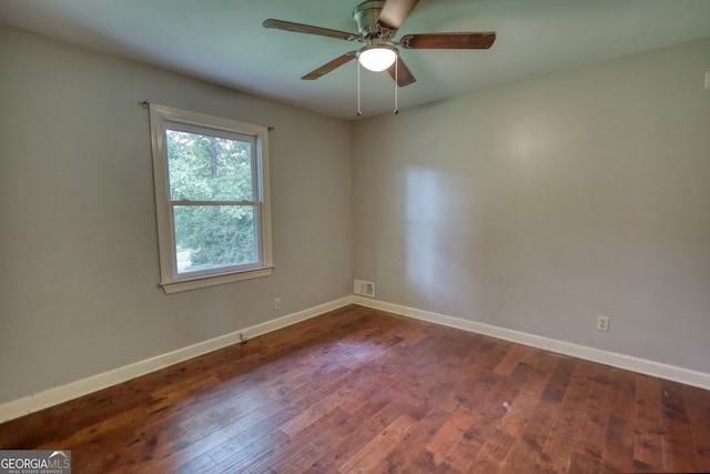 1177 Castle Way, Norcross, GA 30093 - unfurnished room with baseboards, dark wood finished floors, and a ceiling fan