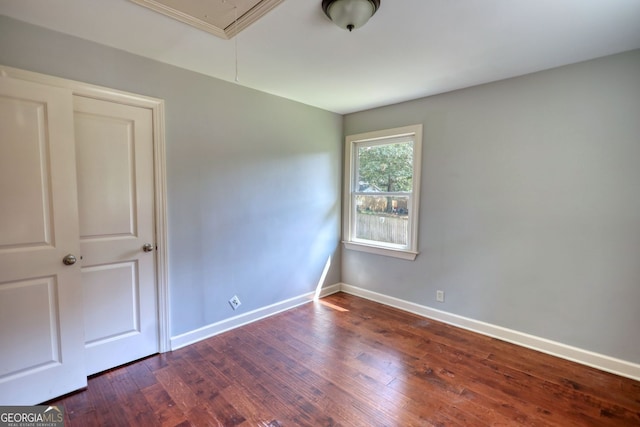 1177 Castle Way, Norcross, GA 30093 - unfurnished room featuring attic access, wood-type flooring, and baseboards