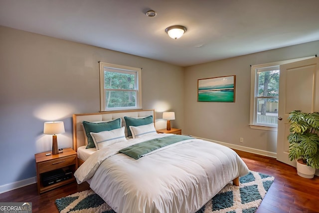 1177 Castle Way, Norcross, GA 30093 - bedroom with multiple windows, baseboards, and wood finished floors