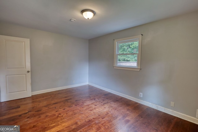 1177 Castle Way, Norcross, GA 30093 - unfurnished room with dark wood-style floors and baseboards