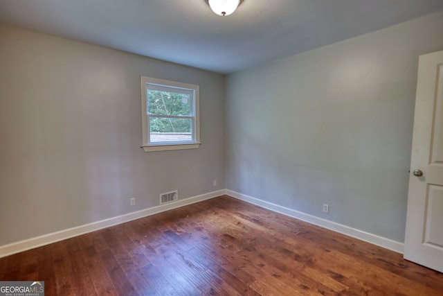 1177 Castle Way, Norcross, GA 30093 - spare room featuring dark wood-style flooring and baseboards