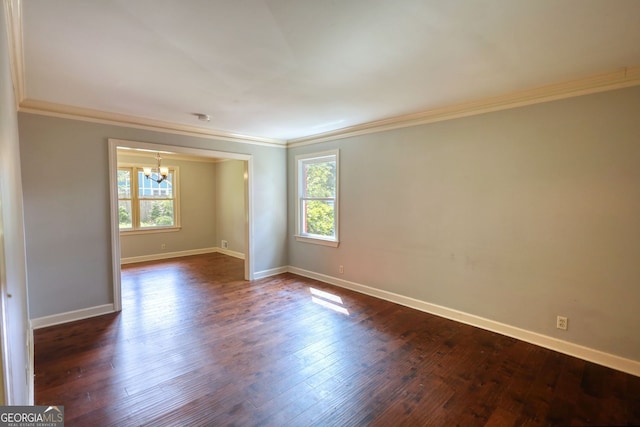 1177 Castle Way, Norcross, GA 30093 - empty room with a chandelier, plenty of natural light, ornamental molding, dark wood-type flooring, and baseboards