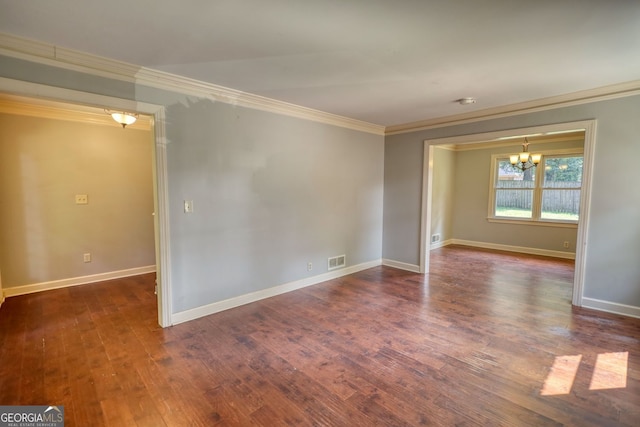 1177 Castle Way, Norcross, GA 30093 - empty room featuring crown molding, a chandelier, wood finished floors, and baseboards