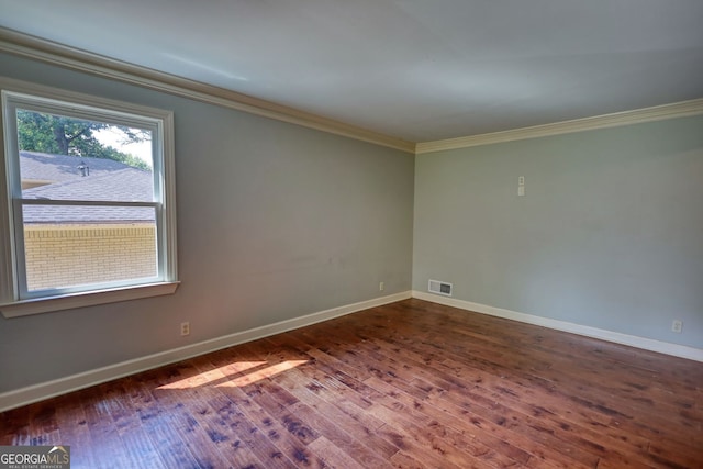 1177 Castle Way, Norcross, GA 30093 - empty room featuring ornamental molding, dark wood finished floors, and baseboards
